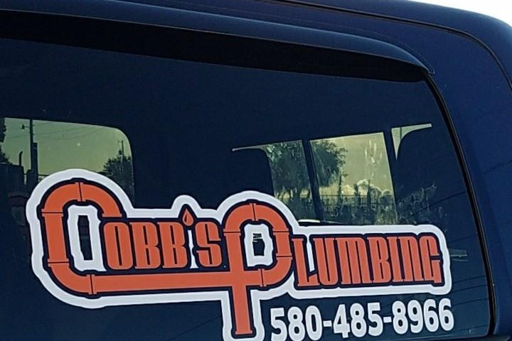 Cobb's Plumbing work truck with the company decal — 580-485-8966